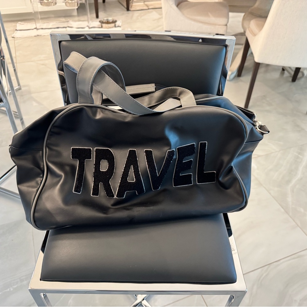 "TRAVEL" Weekender Bag with shoulder strap and handles.
